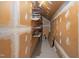 Unfinished storage room with shelving and exposed walls at 2203 Canterbury Dr, Burlington, NC 27215