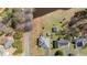 Aerial view of a property featuring a pond, shed, and houses with spacious green lawns at 248 Brookfield Cir, Sanford, NC 27330