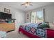 Bedroom featuring a ceiling fan and dresser with a large double-door closet at 248 Brookfield Cir, Sanford, NC 27330