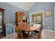 Open dining area with wooden table and access to outdoor patio at 248 Brookfield Cir, Sanford, NC 27330