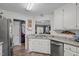 The kitchen boasts granite countertops, stainless steel appliances, and an open view to the living area at 248 Brookfield Cir, Sanford, NC 27330