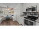 Bright kitchen features stainless steel appliances and a cozy breakfast nook with custom bench seating at 248 Brookfield Cir, Sanford, NC 27330
