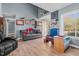 Comfortable living room boasts hardwood floors, neutral paint, and a view of the home's entry at 248 Brookfield Cir, Sanford, NC 27330