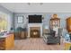 The inviting living room showcases a fireplace, TV, and stylish furnishings, offering comfort and entertainment at 248 Brookfield Cir, Sanford, NC 27330