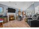 Spacious living room featuring a fireplace, wood floors and an elegant chandelier at 248 Brookfield Cir, Sanford, NC 27330