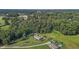 An expansive property featuring a home, lush greenery, and serene surroundings captured from above at 2751 Old Fairground Rd, Angier, NC 27501