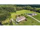 Aerial shot of a home with a pool, storage sheds, and ample green space at 2751 Old Fairground Rd, Angier, NC 27501