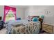 Cozy bedroom with wood frame bed, floral comforter, and bright pink window treatments at 2751 Old Fairground Rd, Angier, NC 27501