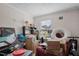 Cluttered bedroom with boxes, furniture, and items scattered throughout the room at 2751 Old Fairground Rd, Angier, NC 27501
