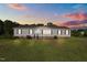 Charming single-story home with well-maintained lawn and classic curb appeal at 2751 Old Fairground Rd, Angier, NC 27501