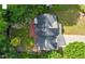 Aerial view of home's roof, yard and brick patio surrounded by trees at 2812 Dahlgreen Rd, Raleigh, NC 27615