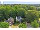 Aerial view showcasing a neighborhood with mature trees and well-maintained two-story homes at 2812 Dahlgreen Rd, Raleigh, NC 27615