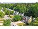 Aerial view of a suburban neighborhood surrounded by lush trees and landscaping at 2812 Dahlgreen Rd, Raleigh, NC 27615