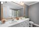 Bathroom with double sink vanity, framed mirror, granite counters, tile floor, and tiled shower at 2812 Dahlgreen Rd, Raleigh, NC 27615
