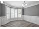 Bright dining room features hardwood floors, large bay windows with shutters, and decorative crown molding at 2812 Dahlgreen Rd, Raleigh, NC 27615