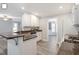 Bright kitchen featuring white cabinets, stainless appliances, granite countertops, and open floorplan at 2812 Dahlgreen Rd, Raleigh, NC 27615