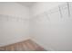 Walk-in closet featuring white walls, trim, and wire shelving offers ample storage space at 296 Beacon Dr, Pittsboro, NC 27312