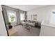 Cozy living room with neutral tones, comfortable seating, and ample natural light at 296 Beacon Dr, Pittsboro, NC 27312