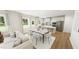 Bright living space with stainless steel appliances and a kitchen island at 296 Beacon Dr, Pittsboro, NC 27312