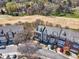 A high angle aerial shot shows a row of townhomes next to a golf course at 3001 Imperial Oaks Dr, Raleigh, NC 27614