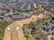 A sprawling residential neighborhood is situated adjacent to a meticulously manicured golf course at 3001 Imperial Oaks Dr, Raleigh, NC 27614