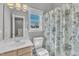 Bright bathroom with a vanity, toilet, and shower/tub combo at 3001 Imperial Oaks Dr, Raleigh, NC 27614