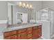 Well-lit bathroom features granite double vanity and glass enclosed shower at 3001 Imperial Oaks Dr, Raleigh, NC 27614