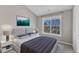 This bedroom has a vaulted ceiling and a large window at 3001 Imperial Oaks Dr, Raleigh, NC 27614