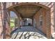 Brick covered patio with arched openings at 3001 Imperial Oaks Dr, Raleigh, NC 27614