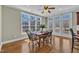 Sunny dining area features hardwood floors, large windows and adjacent access to kitchen at 3001 Imperial Oaks Dr, Raleigh, NC 27614
