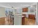 Kitchen area features an eat-in area, breakfast bar, stainless steel appliances and hardwood floors at 3001 Imperial Oaks Dr, Raleigh, NC 27614