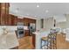 Well-equipped kitchen with granite counters, stainless steel appliances, and bar seating at 3001 Imperial Oaks Dr, Raleigh, NC 27614