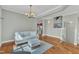 Cozy living area with hardwood floors, plush sofa, and seamless access to kitchen at 3001 Imperial Oaks Dr, Raleigh, NC 27614