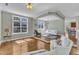 Bright living room features hardwood floors and large windows offering plenty of natural light at 3001 Imperial Oaks Dr, Raleigh, NC 27614