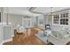 Bright living room boasts hardwood floors, comfortable seating, and French doors at 3001 Imperial Oaks Dr, Raleigh, NC 27614
