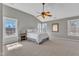 Spacious main bedroom with neutral walls, vaulted ceilings, and large windows at 3001 Imperial Oaks Dr, Raleigh, NC 27614