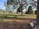 Spacious backyard with mature trees and natural surroundings offers tranquility and privacy at 3009 Kildaire Dairy Way, Apex, NC 27539