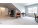Bright bonus room featuring neutral carpet, natural light from a window, and cozy seating area at 3009 Kildaire Dairy Way, Apex, NC 27539