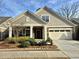 Beautifully landscaped front yard of this house, featuring fresh pine straw and lovely shrubbery at 3009 Kildaire Dairy Way, Apex, NC 27539