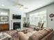 Modern kitchen with white cabinets, a stainless steel refrigerator, and a stylish island with seating at 3009 Kildaire Dairy Way, Apex, NC 27539
