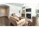 Inviting living room with fireplace, comfortable seating, and hardwood floors. Lots of natural light at 3009 Kildaire Dairy Way, Apex, NC 27539