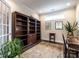 Study room with a large bookcase, wood desk, and natural light at 3009 Kildaire Dairy Way, Apex, NC 27539