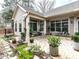 This lovely home features a brick paver patio, manicured flower beds, and space for outdoor seating at 3009 Kildaire Dairy Way, Apex, NC 27539