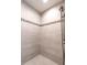 Stylish walk-in shower features decorative tile and modern fixtures at 3009 Kildaire Dairy Way, Apex, NC 27539
