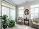 Bright sun room with lots of natural light and comfortable seating at 3009 Kildaire Dairy Way, Apex, NC 27539