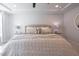 Inviting main bedroom with cozy bedding, recessed lighting, and bright windows at 3144 Star Gazing Ln, Durham, NC 27703