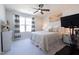Comfortable bedroom with a ceiling fan, bright window, and neutral decor at 3144 Star Gazing Ln, Durham, NC 27703