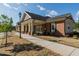 Attractive community building featuring brick facade, covered entrance, and well-manicured landscaping at 3144 Star Gazing Ln, Durham, NC 27703