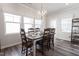 Elegant dining room with a large table, stylish chandelier, and bright windows at 3144 Star Gazing Ln, Durham, NC 27703