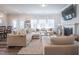 Cozy living room featuring a comfortable sectional, fireplace, and plenty of natural light at 3144 Star Gazing Ln, Durham, NC 27703